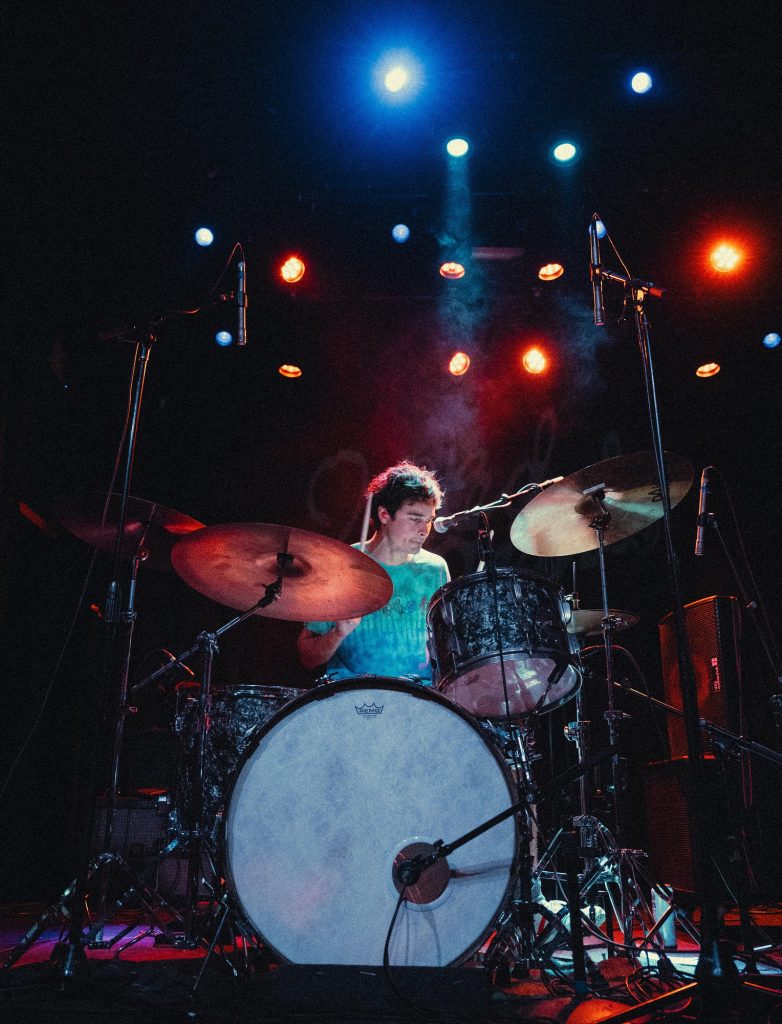 Henry LaVallee, drummer for Naked Giants, keeps the rhythm tight, powering the band's performance with precision and energy. Photographed by Amy Miranda/BruinLife.