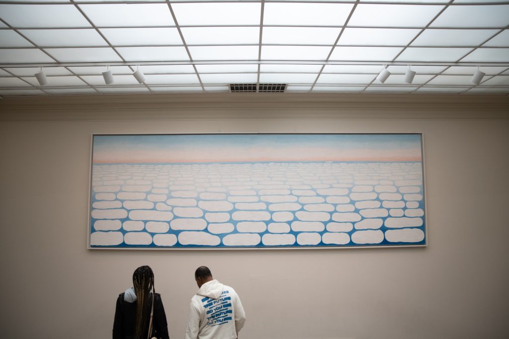 Georgia O&squot;Keeffe&squot;s "Sky Above Clouds IV" shines high over visitors to the museum&squot;s modern art wing. Photographed by Finn Martin/BruinLife.