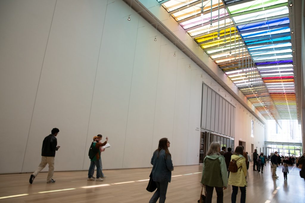 A rainbow canopy glitters down onto museum-goers as they exit the grounds. Photographed by Finn Martin/BruinLife.