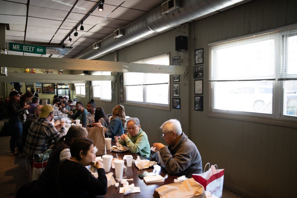 Grab your sandwich and bring it back to Mr. Beef Boulevard, a casual dining space where you'll eat in the company of family memories of the owners photographed on the wall. Photographed by Finn Martin/BruinLife.