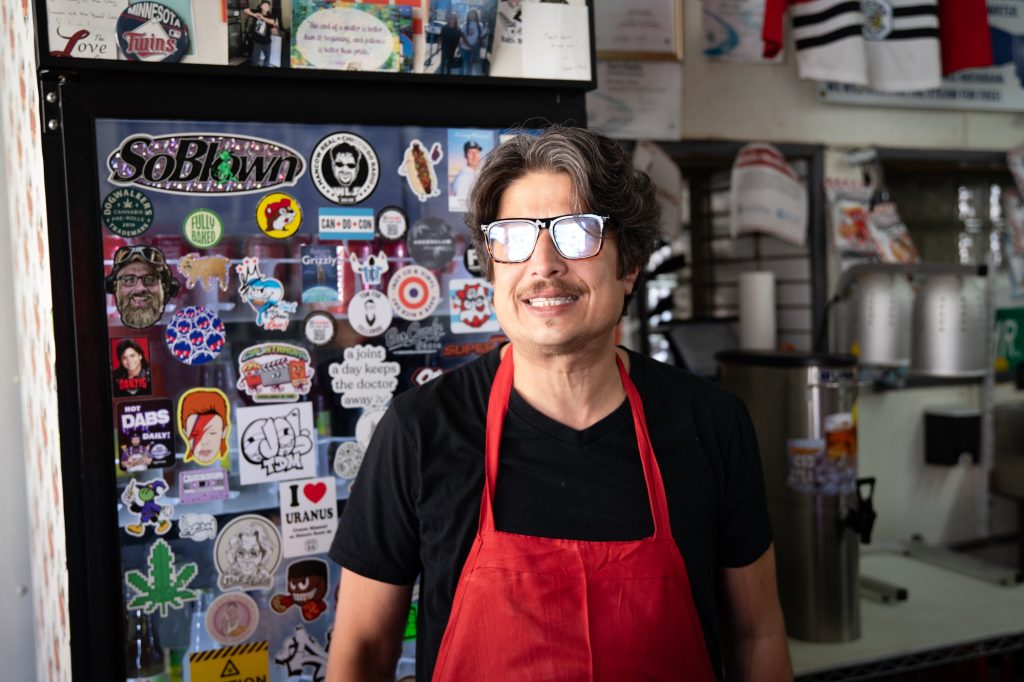 Chris Zucchero, the owner of Mr. Beef, stands proudly behind the counter of his sandwich shop. Photo by Finn Martin/BruinLife