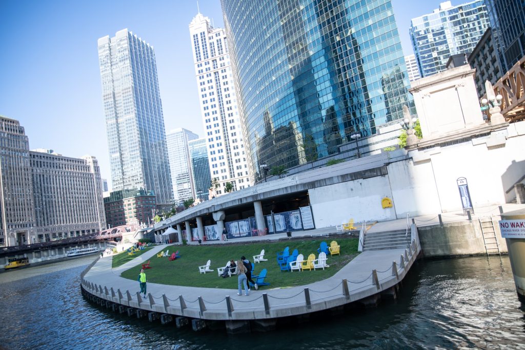 The Chicago River is mostly wrapped on both sides by an accessible river walk that offers green spaces as pictured and an ample helping of bars and restaurants. Photographed by Finn Martin/BruinLife.