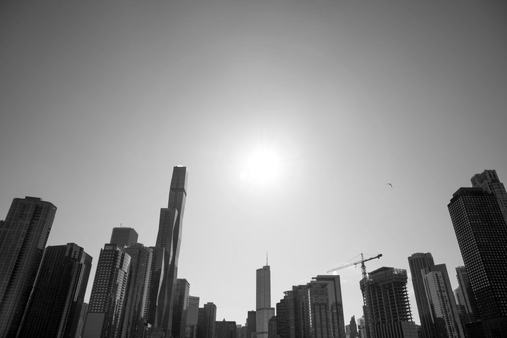 The river boat tour wraps its route at the boundary line built to regulate flow between the Chicago River and Lake Michigan. From here, with a little dramatic pause, the boat stops to allow passengers to take in the skyline view of Chicago. Photographed by Finn Martin/BruinLife.