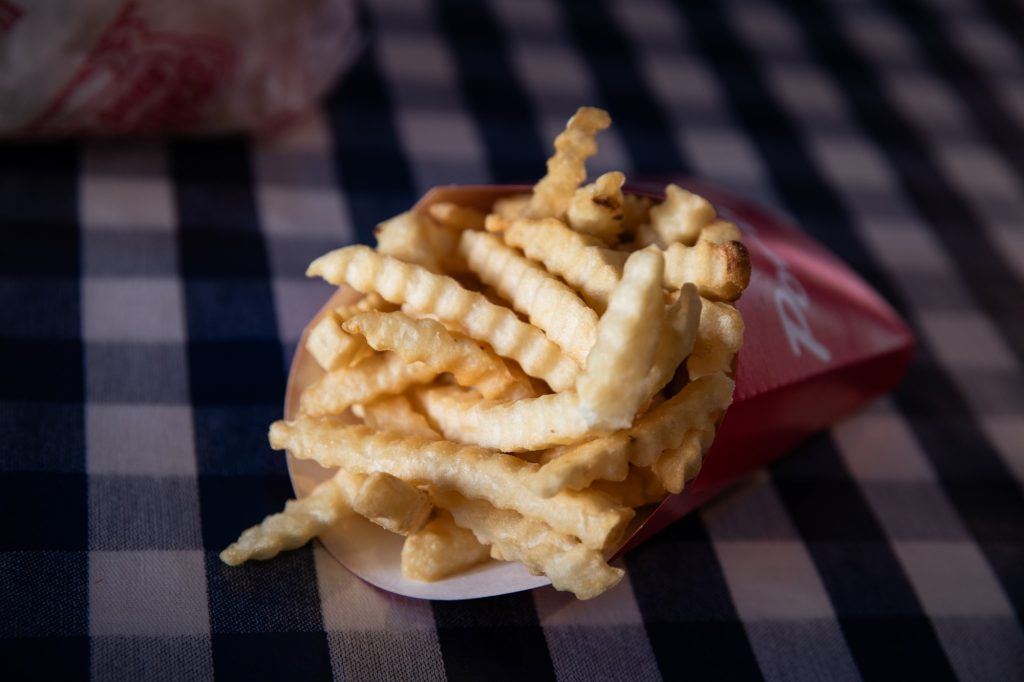 Crinkle cut fries that make up for their lack of structure with their weight of salt. Photographed by Finn Martin/BruinLife.
