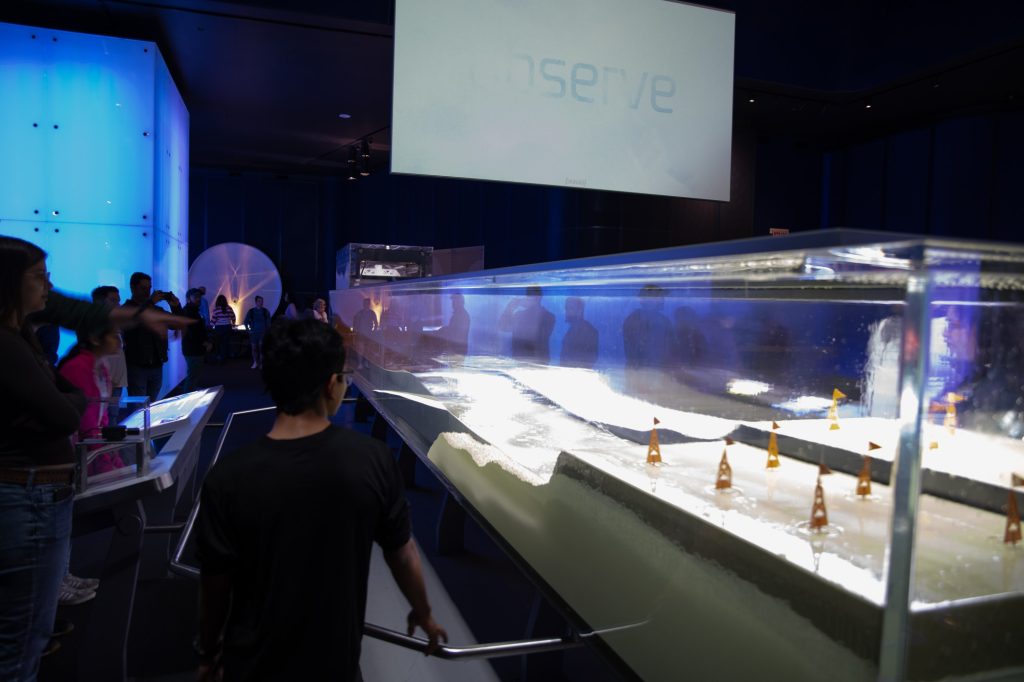 A tank simulates tsunami conditions for visitors. Photographed by Finn Martin/BruinLife.