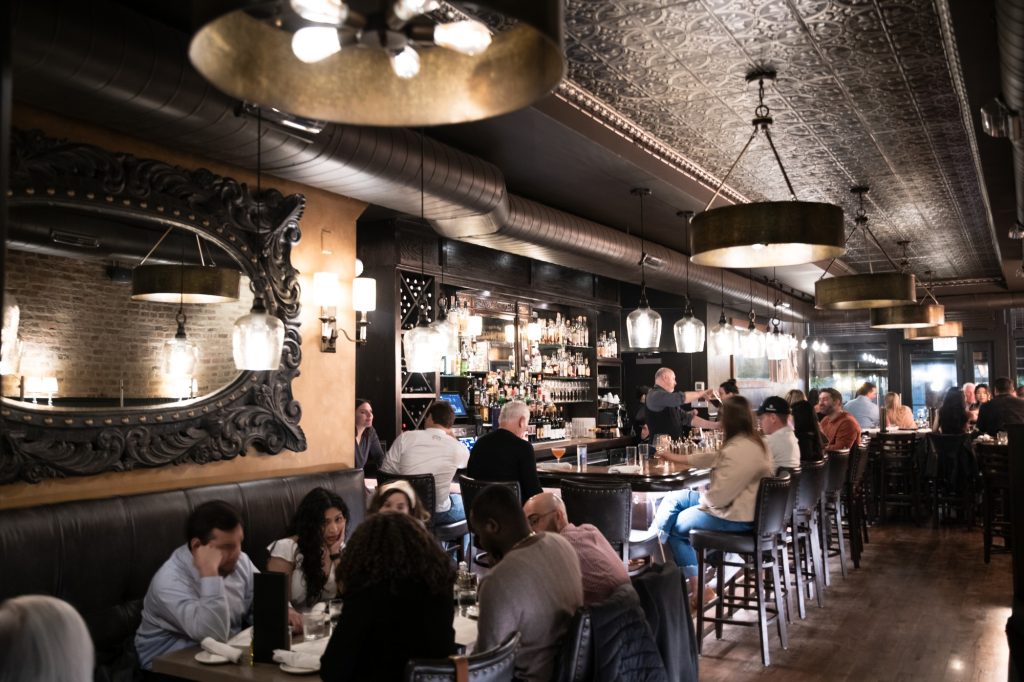Valley spent several years visiting other bars with a notebook and pencil in hand to jot together the dream vision for Torchio Pasta Bar's interior. Photographed by Finn Martin/BruinLife.