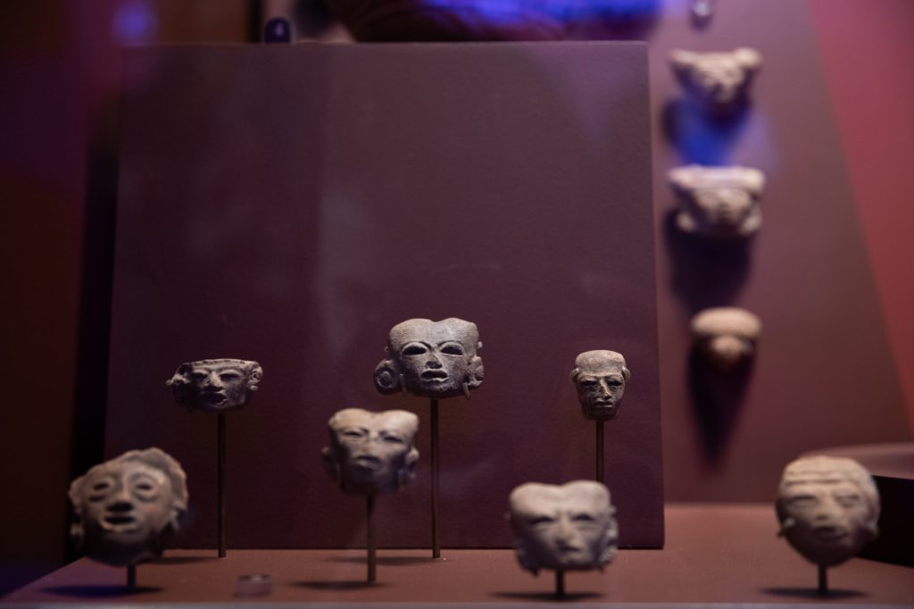 Miniature Aztec masks are on display. Photographed by Finn Martin/BruinLife.