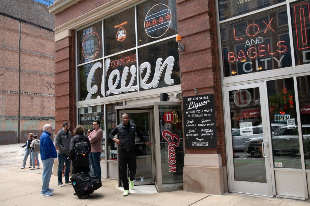 The storefront of the Eleven City Diner is decorated with glowing neon signs. Photographed by Finn Martin/BruinLife.