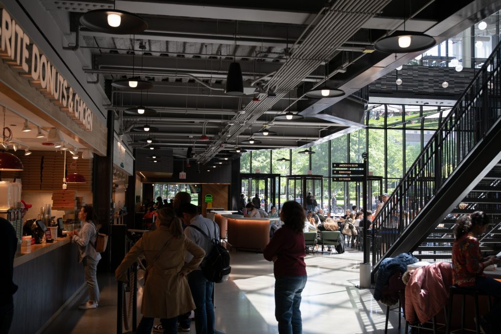 Tourists stop for food and drink inside Willis Tower. Photographed by Finn Martin/BruinLife.