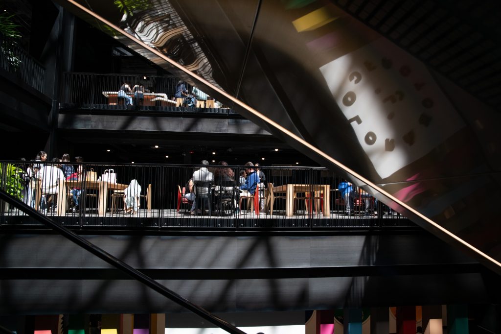 Dining terraces stack throughout the building. The entrance to the Skydeck is ironically reachable by first going down. Photographed by Finn Martin/BruinLife.