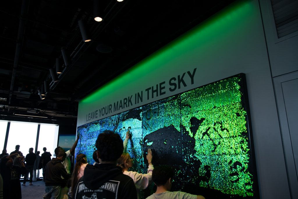 Visitors surround an attraction inside Chicago's Willis Tower. Photographed by Finn Martin/BruinLife.