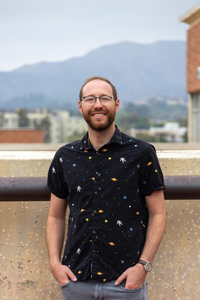 Instructor Jack Lubin stands against a mountainous backdrop from the 8th floor of the Math & Sciences Building, where the planetarium can be found. Photographed by Jaclyn Wang/BruinLife