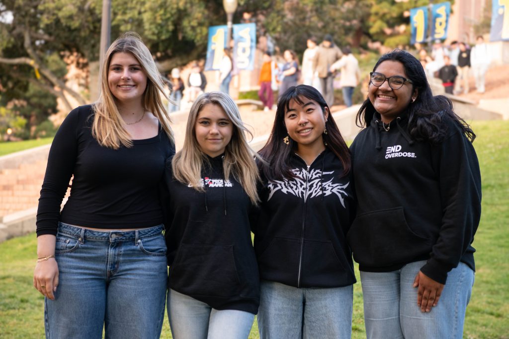 The End Overdose board at Janss Steps. Kenan Thomas, Cayla Younger, Akane Shimoyoshi and Shreya Sundar(Left to Right). Photographed by Khaled Al Duwaikat/BruinLife.