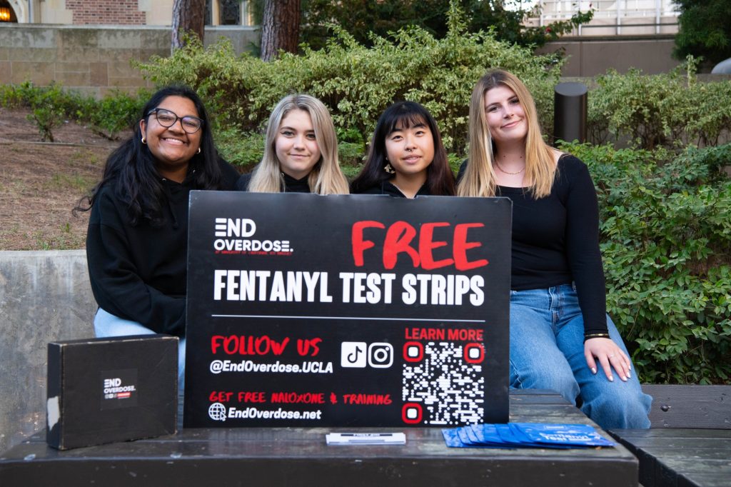 The End Overdose board on Bruinwalk. Shreya Sundar, Cayla Younger, Akane Shimoyoshi and Kenan Thomas, (Left to Right). Photographed by Khaled Al Duwaikat/BruinLife.