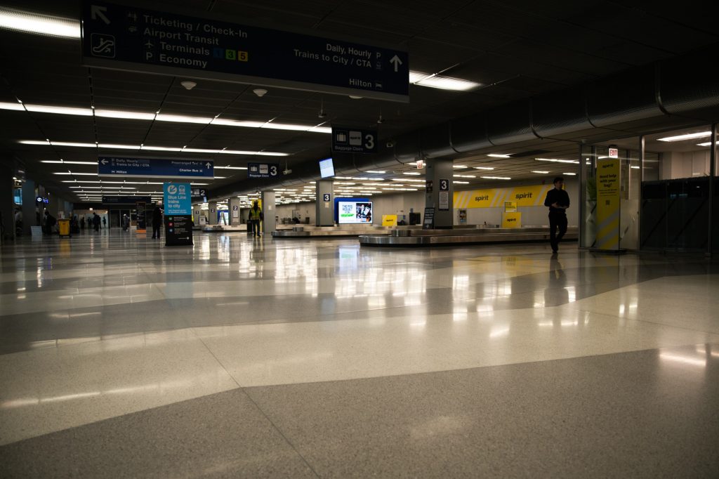 Fear the Zamboni and its reflective wake! The chevroned tiles of the baggage claim provide an ethereal experience without the usually required ether. Photographed by Finn Martin/BruinLife.