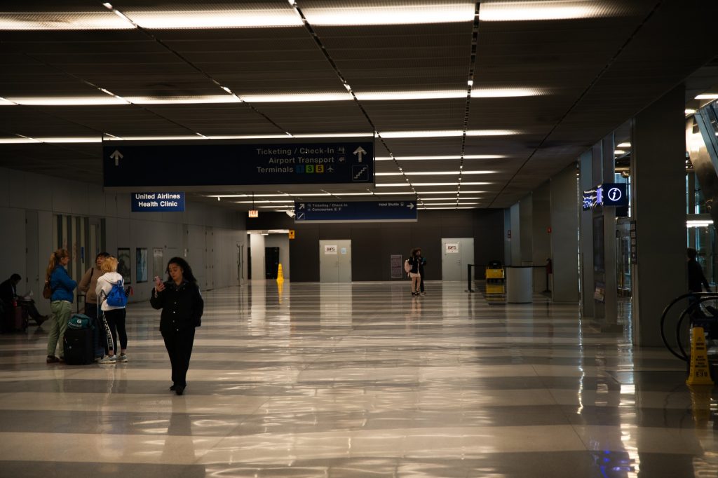Fear the Zamboni and its reflective wake! The chevroned tiles of the baggage claim provide an ethereal experience without the usually required ether. Photographed by Finn Martin/BruinLife.