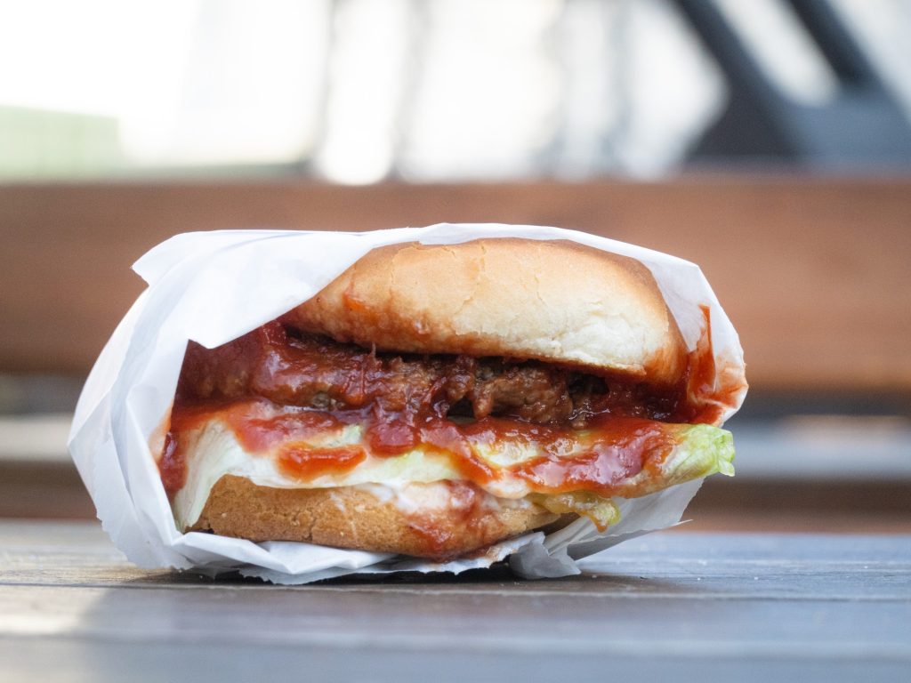 Compact and lathered with a smokey hickory barbecue sauce, the Hickory Burger offers an easy but delectable bite. Photographed by Finn Martin/BruinLife.