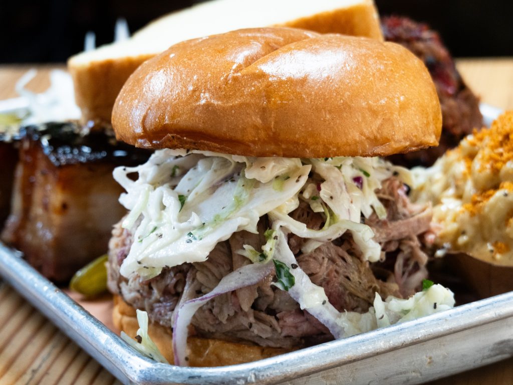 An impressive sight, the pulled pork sandwich packs in an ample amount of pork but, when sauced right, presents a consistently savory bite. Photographed by Finn Martin/BruinLife.