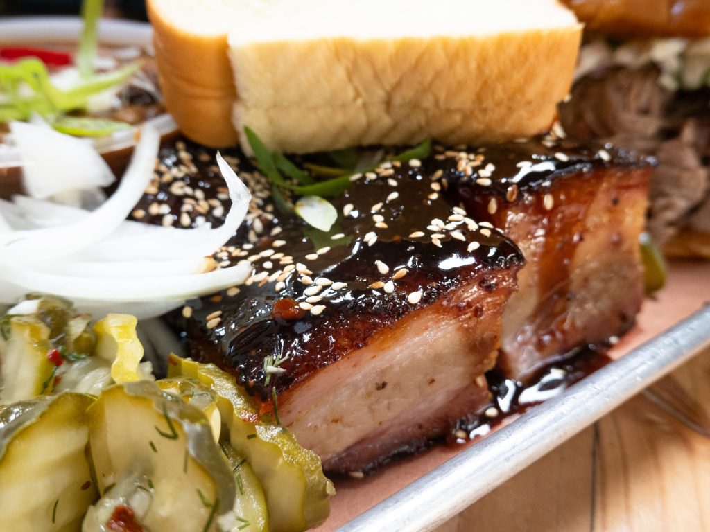 The Korean Sticky Glazed Pork Belly Burnt Ends are both a mouthful of a name and a mouthwatering entree to order. Photographed by Finn Martin/BruinLife.