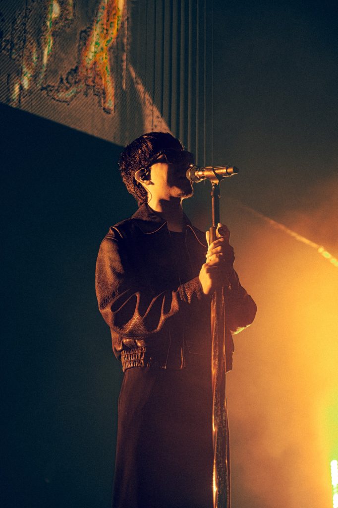 At the mic stand, Cornejo delivers each lyric with calm intensity. Photographed by Amy Miranda/BruinLife
