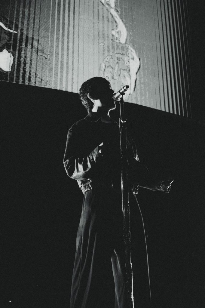 Cornejo powers through the chorus, breaking his grip free from the mic stand in a surge of energy. Photographed by Amy Miranda/BruinLife