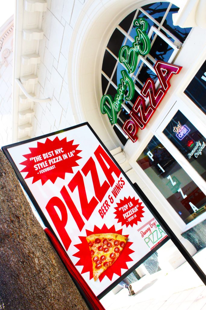 A literal promising sign, this poster stands outside the storefront, beckoning people in. Photo by Gavin Meichelbock.