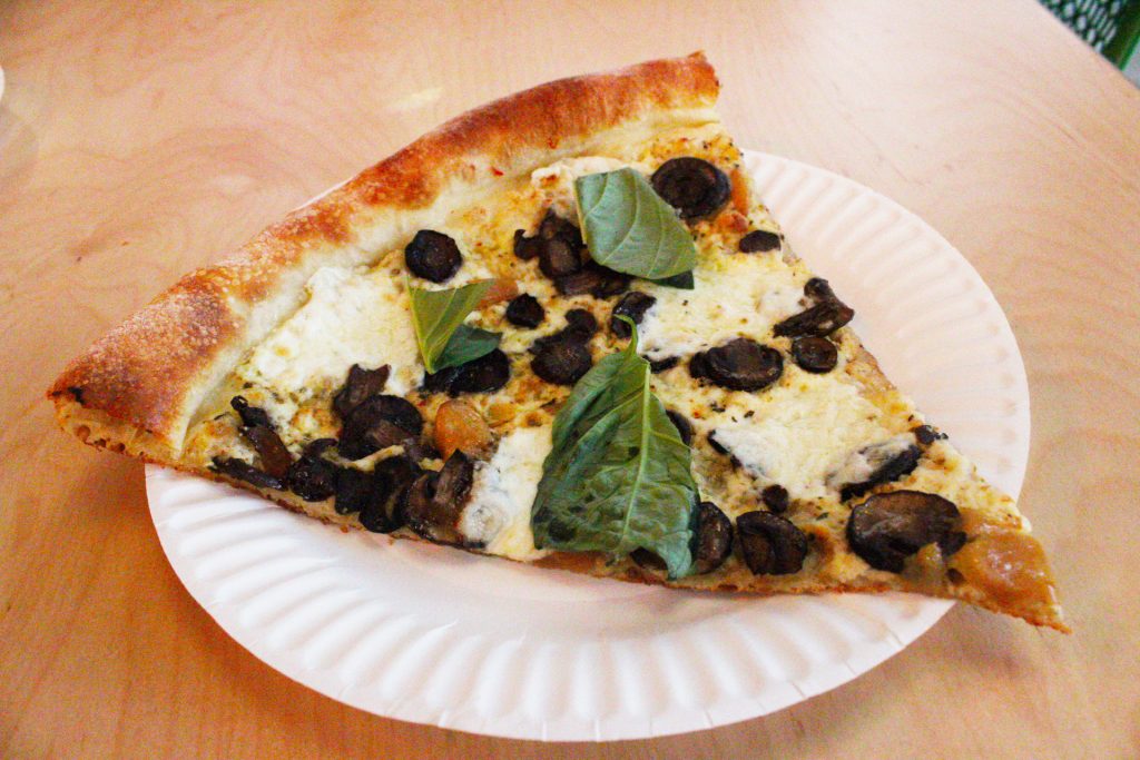 With mushrooms and leaves on this slice, this pizza should be considered a health food. Photo by Gavin Meichelbock/BruinLife.